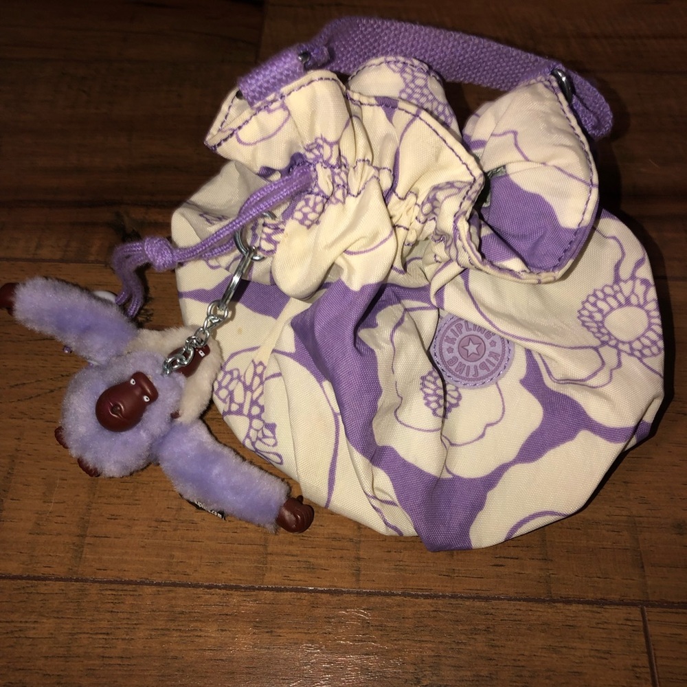 Kipling Clutch that has a short handle